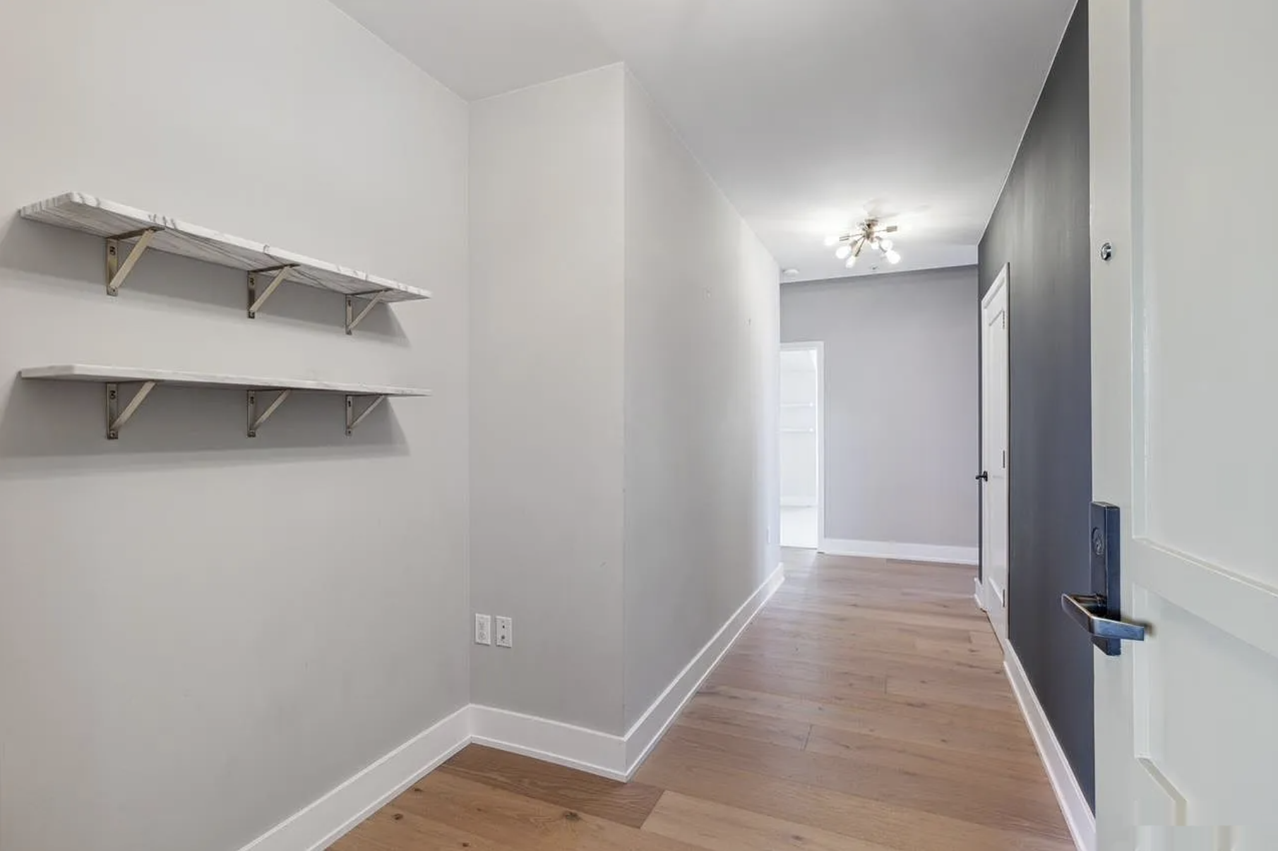 Entry hallway virtual staging — original listing photo