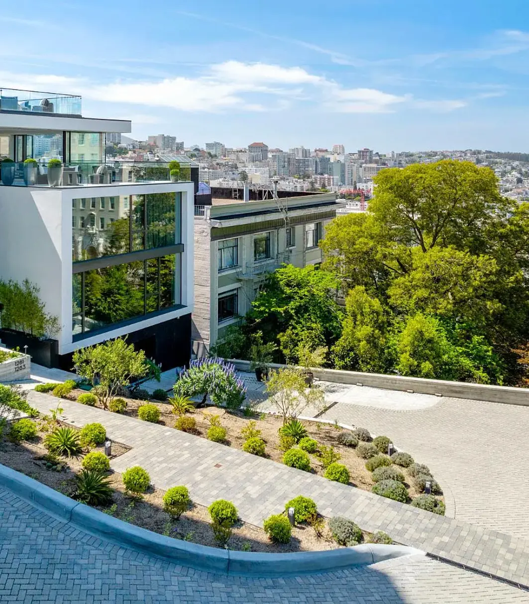 Home exterior with landscaped path — original listing photo