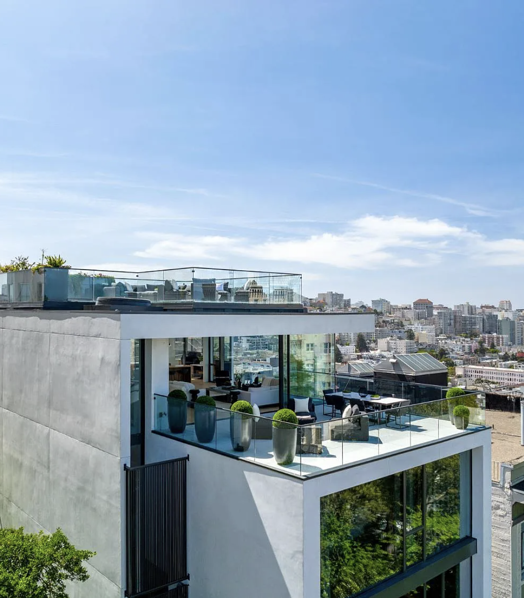 Aerial view of rooftop and skyline — original listing photo