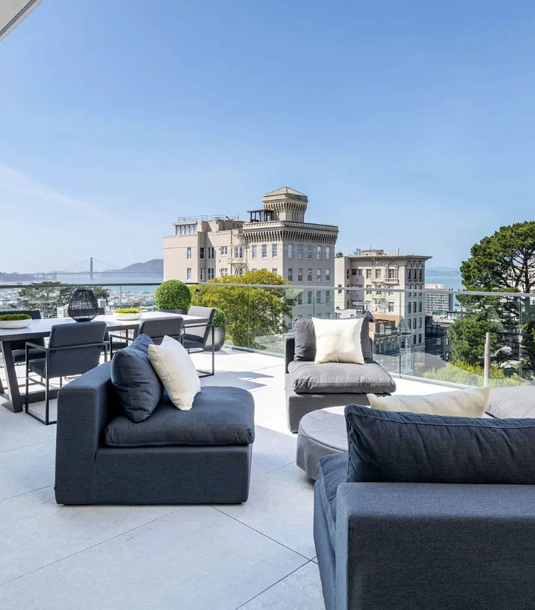 Deck terrace with lounge furniture — original listing photo